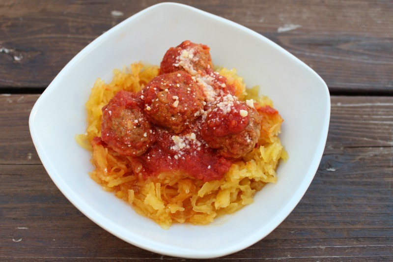 This Crock Pot Spaghetti Squash and Meatballs is incredibly easy and a low carb alternative to traditional spaghetti and meatball recipes!